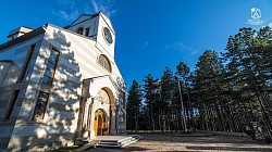 Panoramic view of the Temple of the Transfiguration viewed from the direction of Zlatibor Lake and the King's Square, where the calm and dignified silhouette of the church stands out against the background of modern tourist facilities