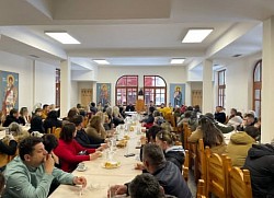 festive table of love in the porta after the slava liturgy