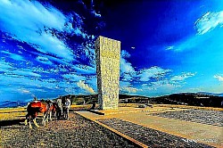 The shadow of an eagle flying quickly over the golden carpet of Zlatibor grass Deposits of loose snow on wooden ladders leaning against an old hut The sharp smell of ozone and conifers after a storm cloud has passed Pine tree tops rhythmically hitting each other in gusts of wind A mountain meadow covered in frost that looks like thousands of tiny diamonds An endless blue horizon above rounded slopes without a single tree - Cracks in the parched mountain soil from which firm tufts of grass emerge Light green lichens that cover old wooden pasture fences like a patina Deep tractor tire tracks filled with rainwater on a country road through the forest Pine tree tops completely covered in frost that resemble white crystal chandeliers A lonely stone tombstone covered in moss on the edge of a mountain ridge Steam escaping from the nostrils Cattle grazing on a cold Zlatibor morning. Red hawthorn berries that create a strong contrast against the gray background of the autumn sky.