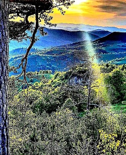 Crystal clear blue sky above the peak of Tornik without a trace of smog or dust Golden threads of sunlight breaking through the gaps in an old wooden hayloft A network of mountain streams that weaves like silver veins on the slope Frozen peaks of tall grass that crack under the weight of the first snow Old haystacks protected by nylon in a remote and desolate clearing Silence in the canyon that is occasionally broken only by a small rock slide in the distance - A huge stone pile at the very top of the hill that serves as a landmark for hikers Swirling powder of snow that the wind raises from the frozen Zlatibor pastures An old pine tree with bare roots that clings convulsively to the rocky slope The light gray bark of a beech forest that shimmers in the moonlight like metal A lonely mountain path covered with small gravel that leads into the unknown The red horizon above the dark mountain contours in the few minutes before complete darkness