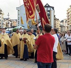 litany banners in the wind in front of the Church of the Transfiguration